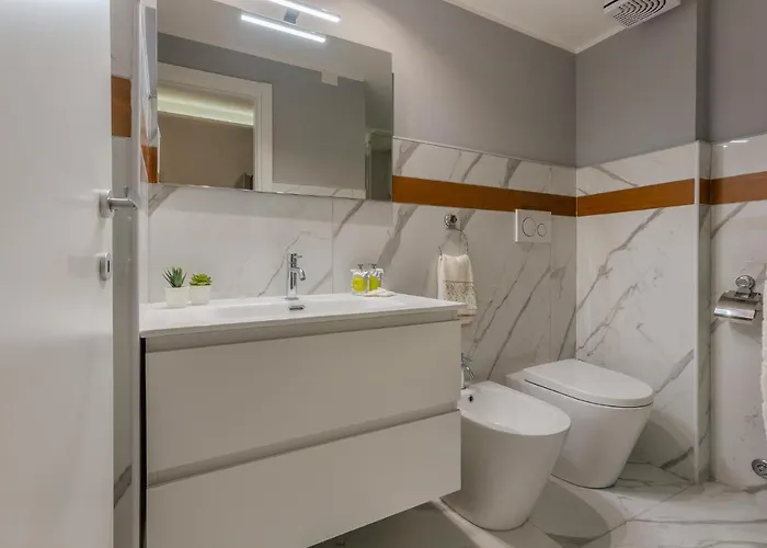 Guesthost - Mini Loft San Carlo A 5 Min Da Mambo Apartment